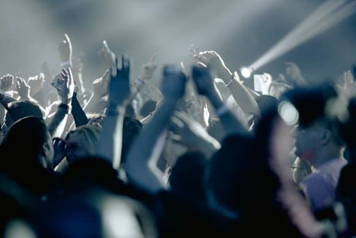 A group of fans partying at a concert.