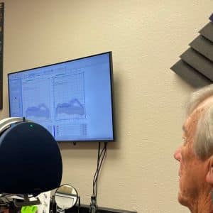 A man takes a free hearing test at Wichita Falls Hearing