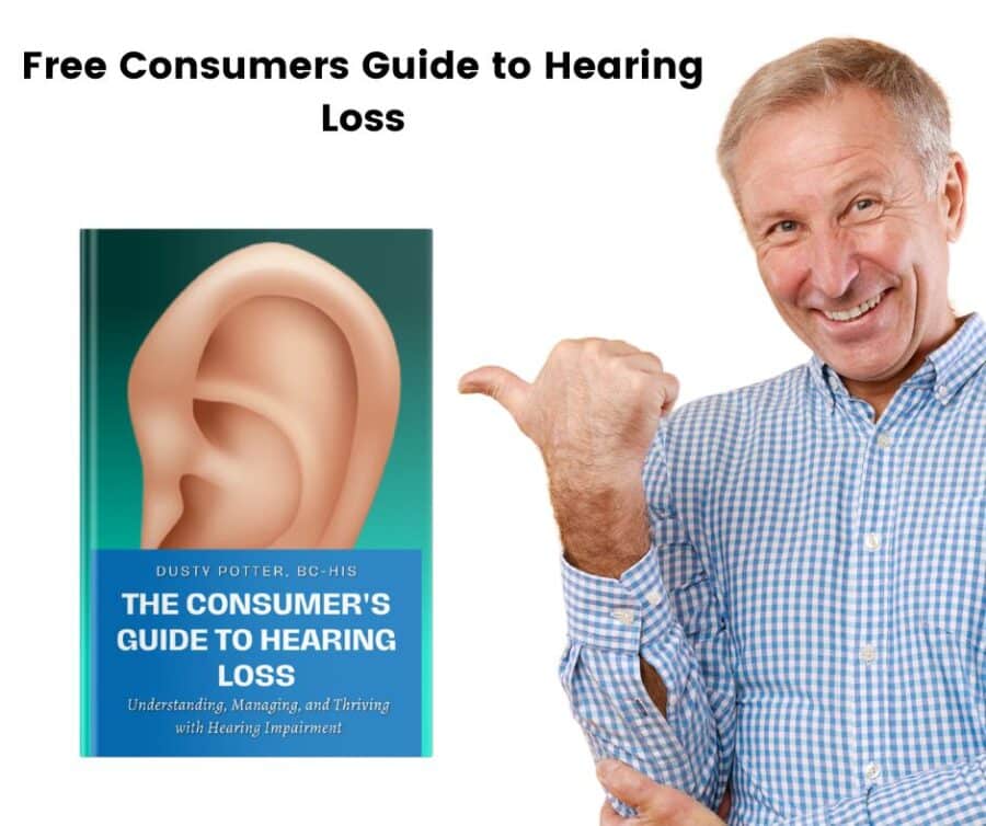A man points at the consumers guide to hearing loss while smiling
